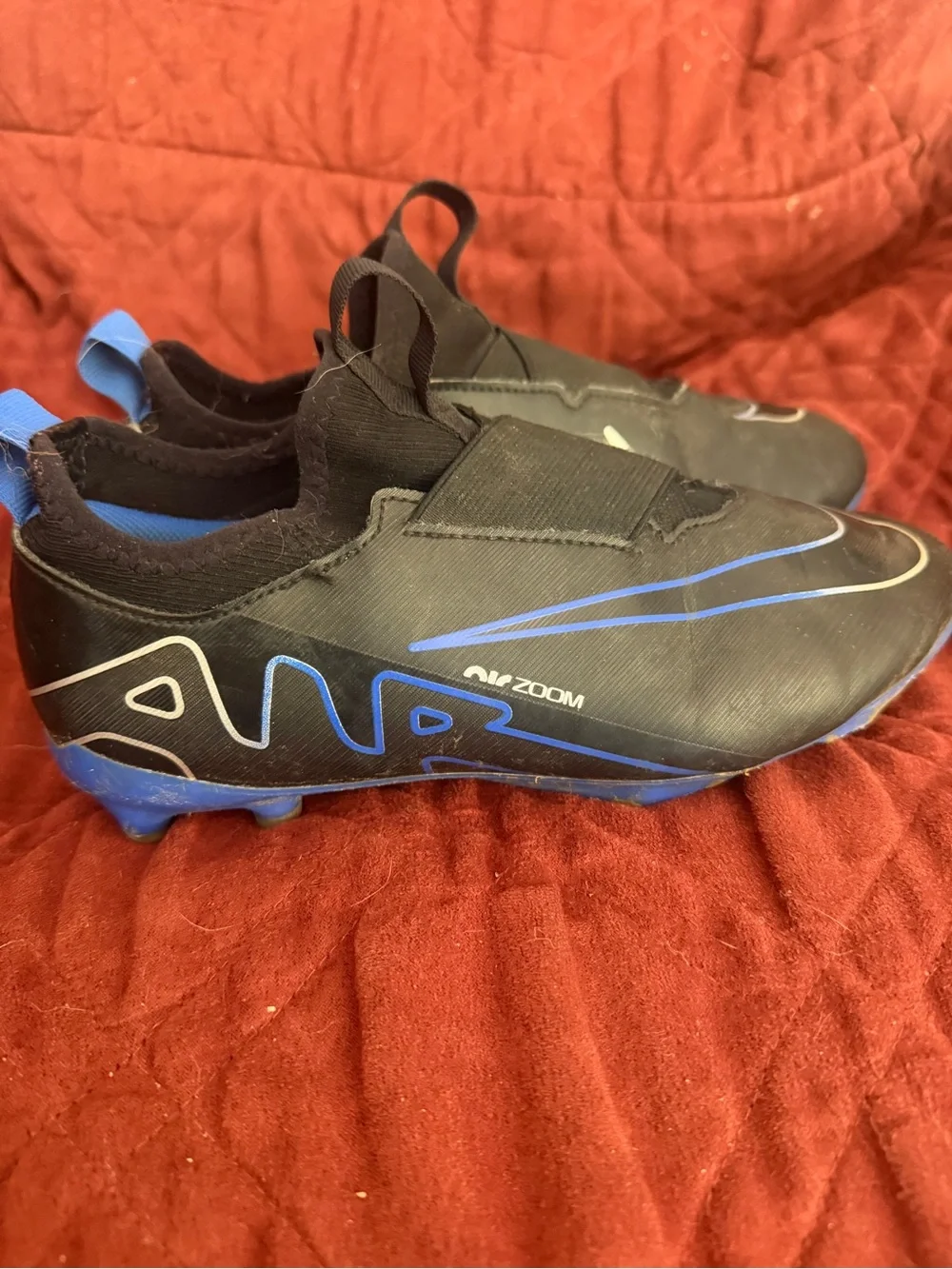 Nike Kids Black and Blue Slip-On Soccer Cleats with Air Zoom